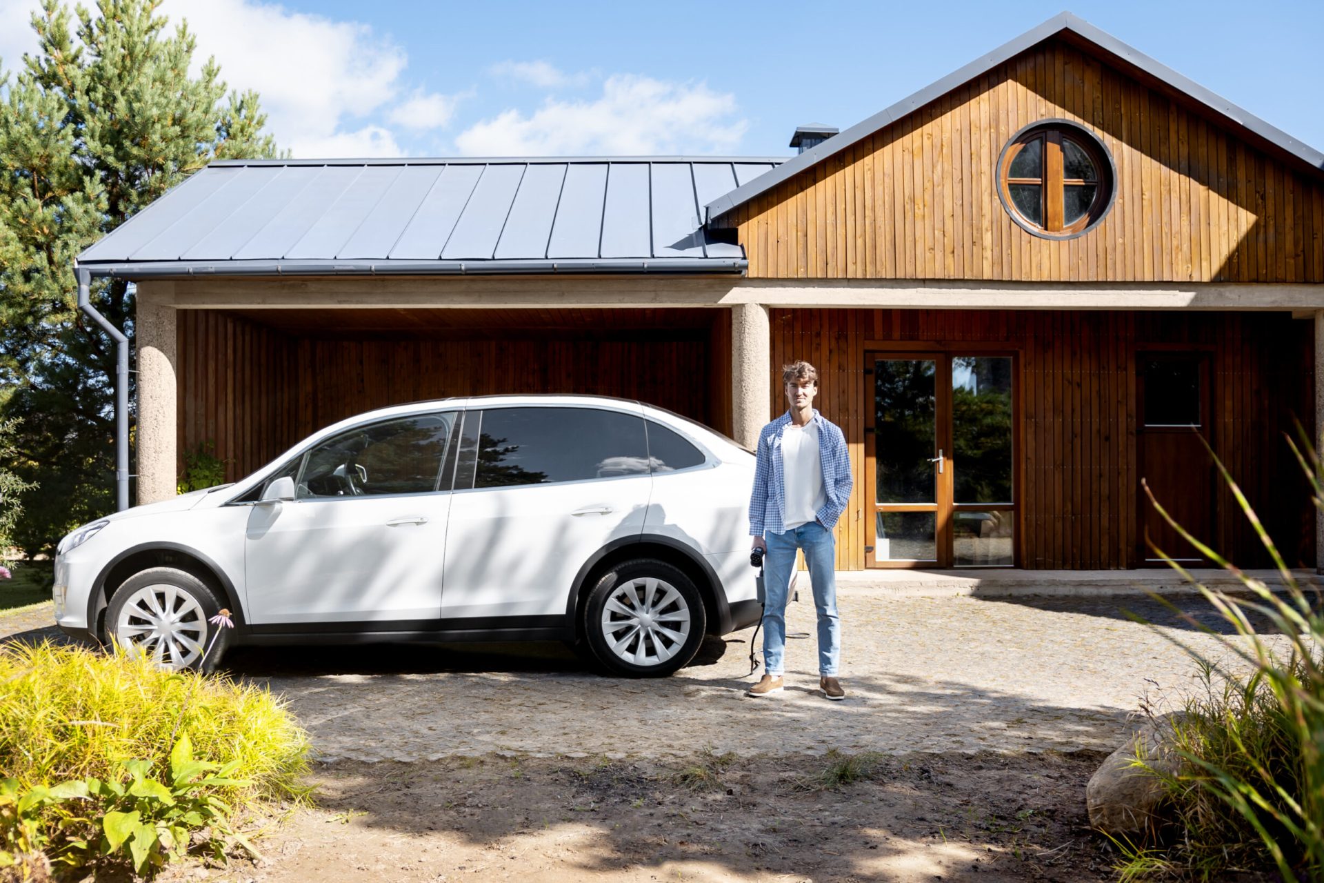 person-taking-care-electric-car